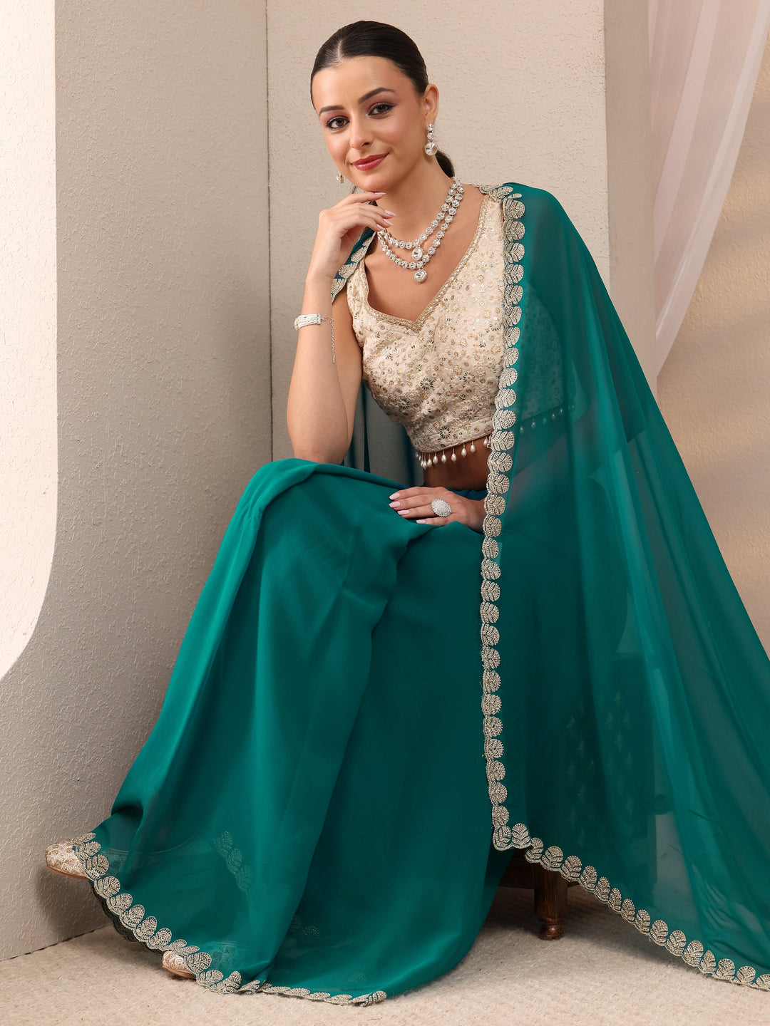Teal Green Embellished Silk Blend Saree 
With Unstitched Blouse Piece