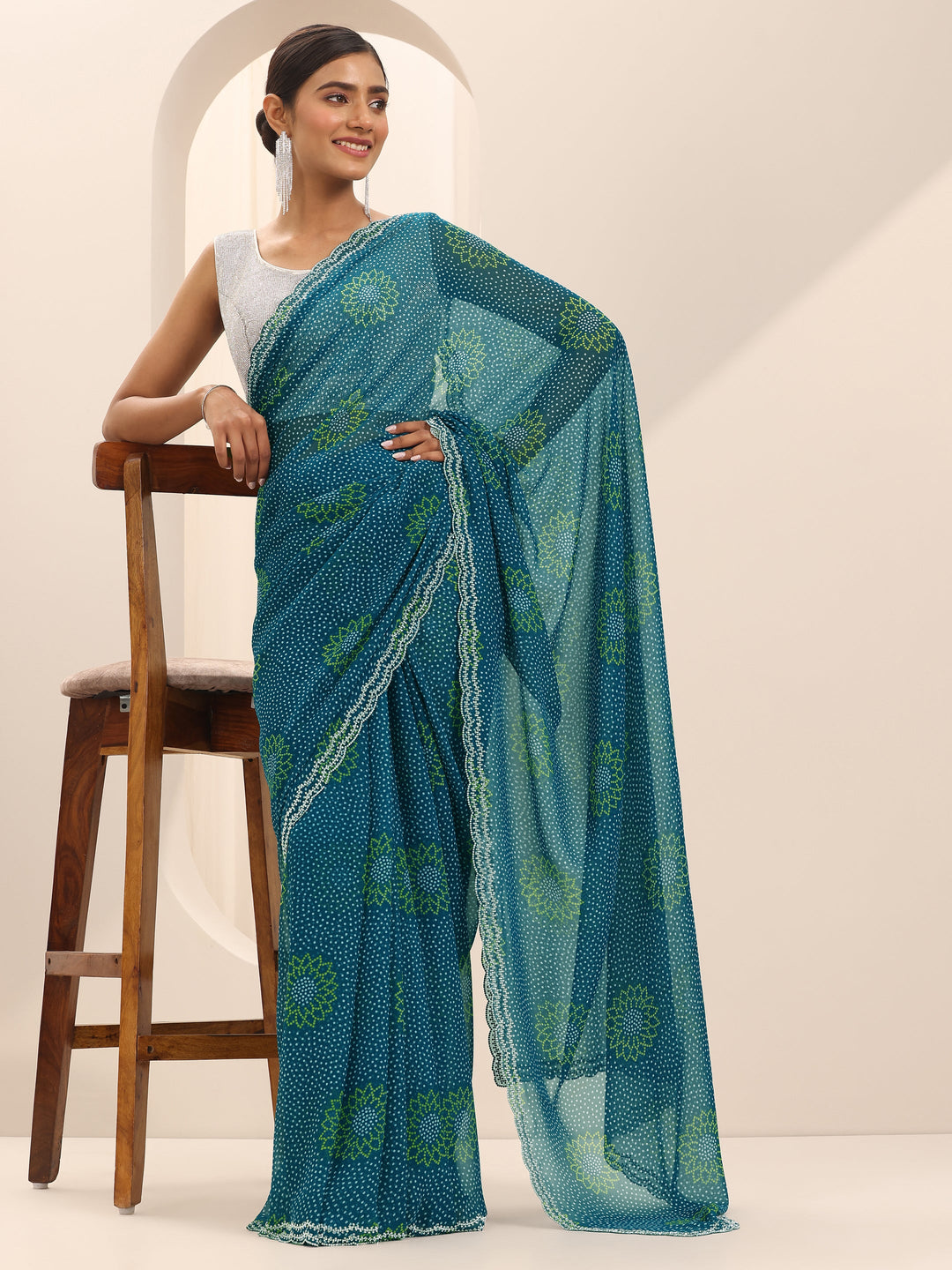 Teal Printed Georgette Saree With Unstitched Blouse Piece